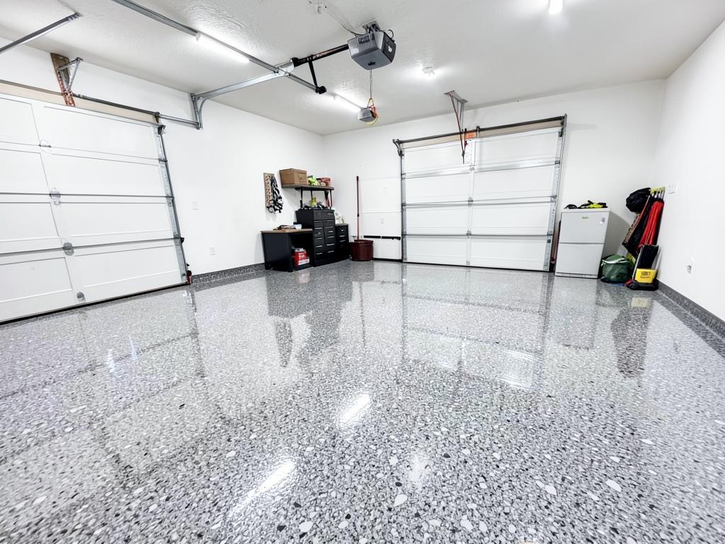 Finished epoxy-coated garage floor with a decorative flake finish